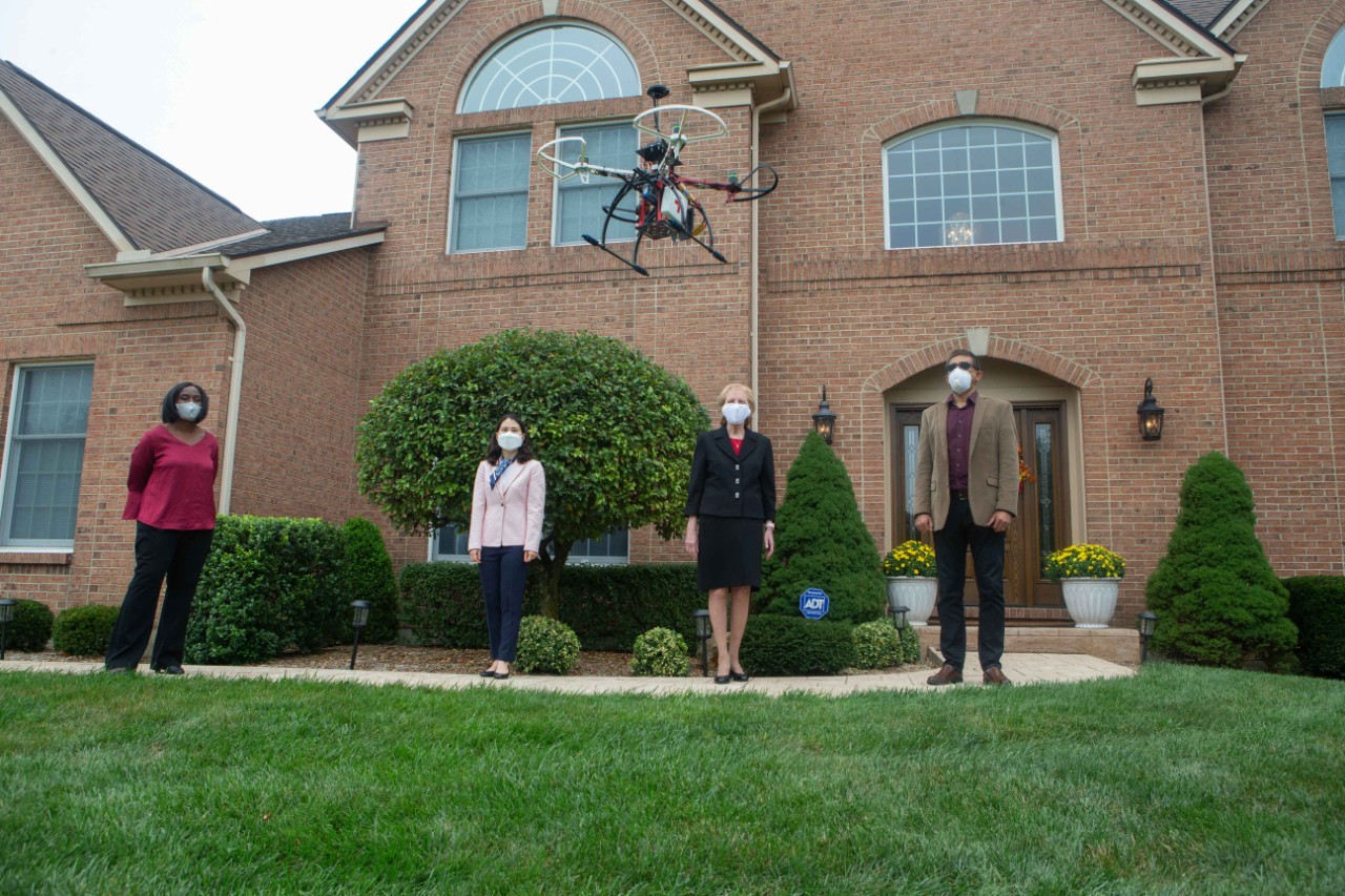 Left to right professor educator director Victoria Wangia-Anderson, associate professor Seung-Yeon Lee, PhD professor Manish Kumar, PhD, and Dr. Debi Sampsel, DNP shown here drone at the home of Dr. Sampsel in West Chester. UC/ Joseph Fuqua II