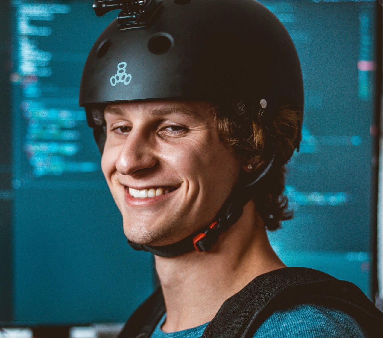 Jake Hemmerle poses in a skydiving helmet.
