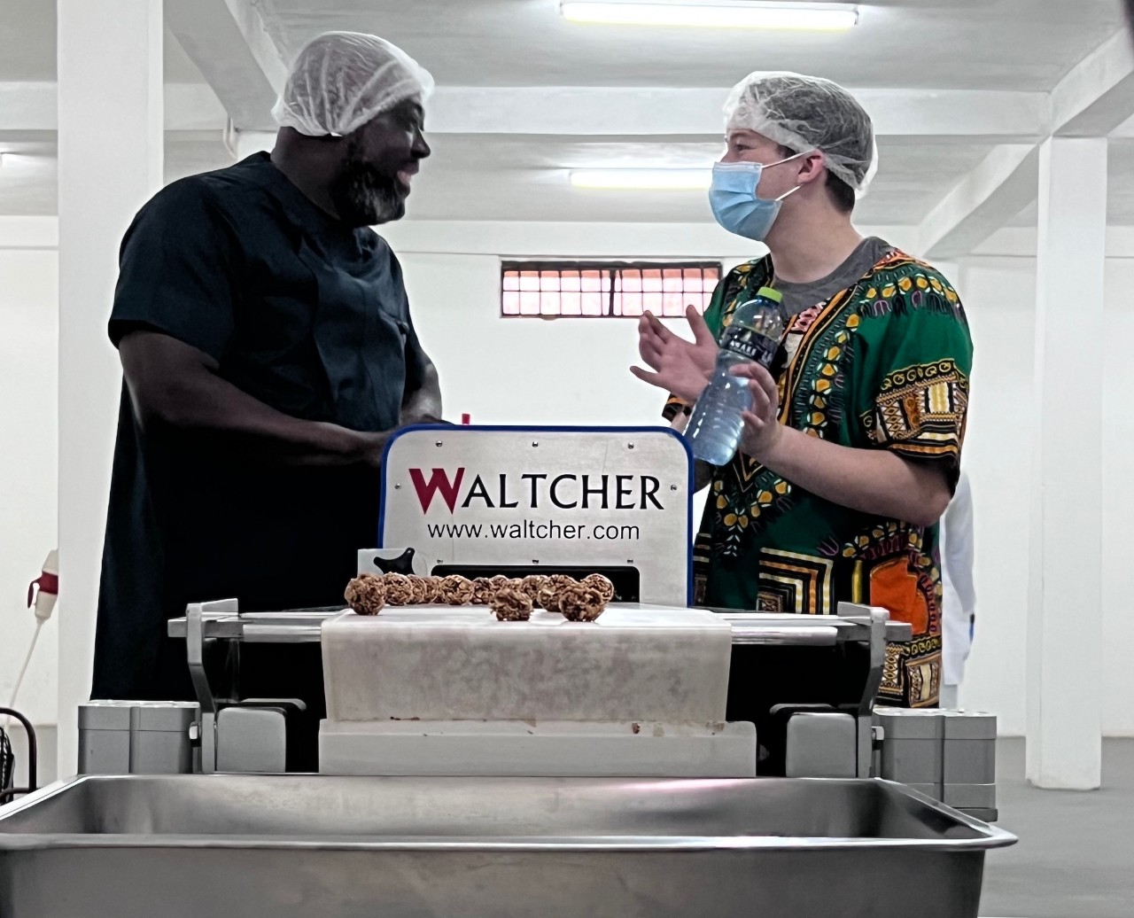 Alex Ravagnani and employee in factory.