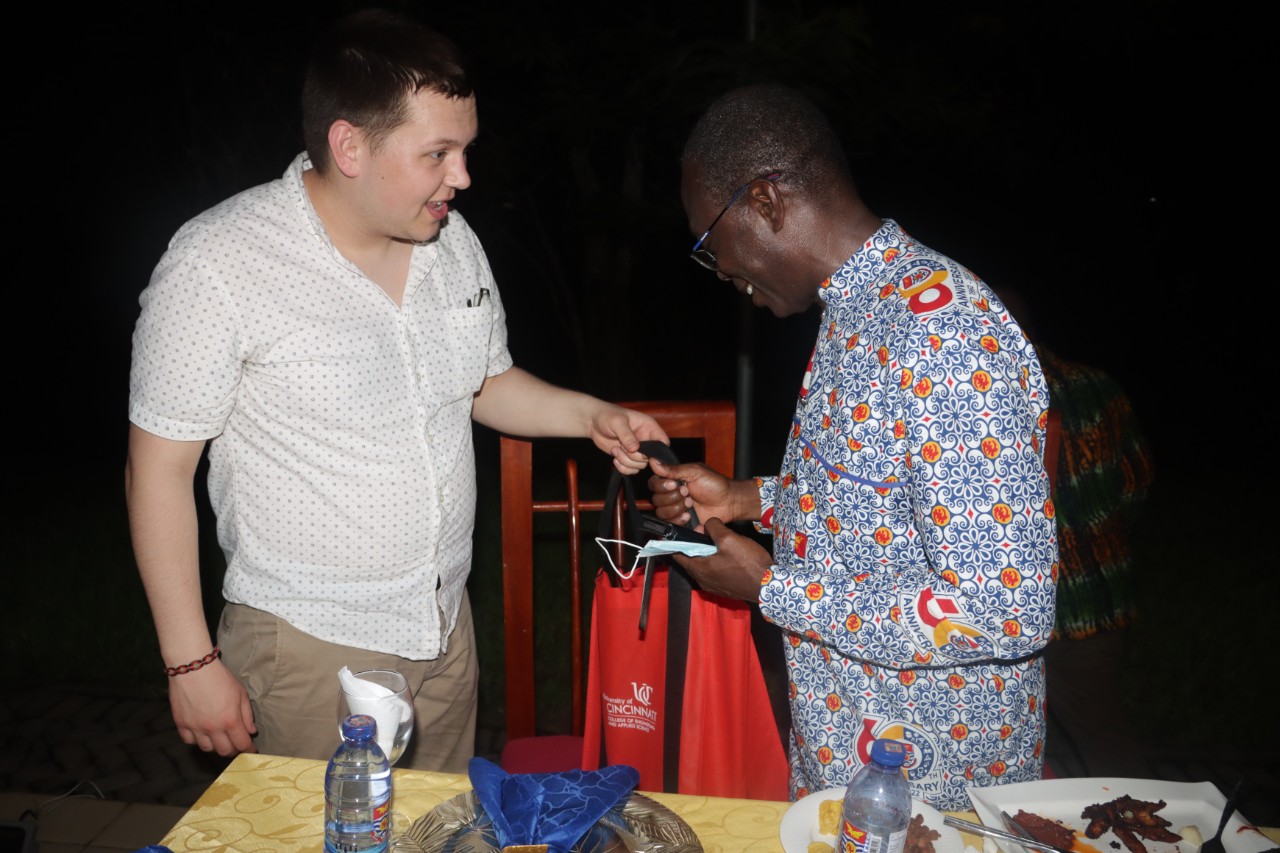 UC student gives CEAS gift bag to UCC vice chancellor