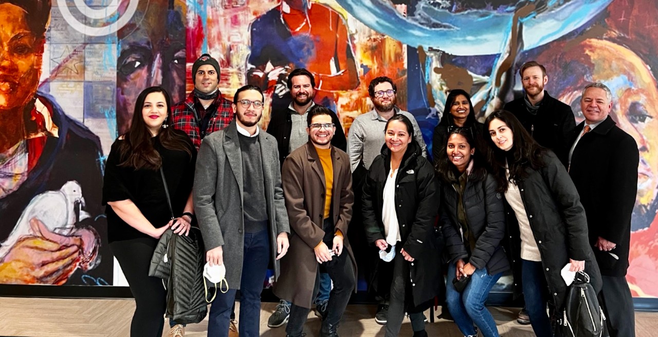 UC DAAP alum Saakshi Terway stands among new coworkers at architecture firm in Washington DC.