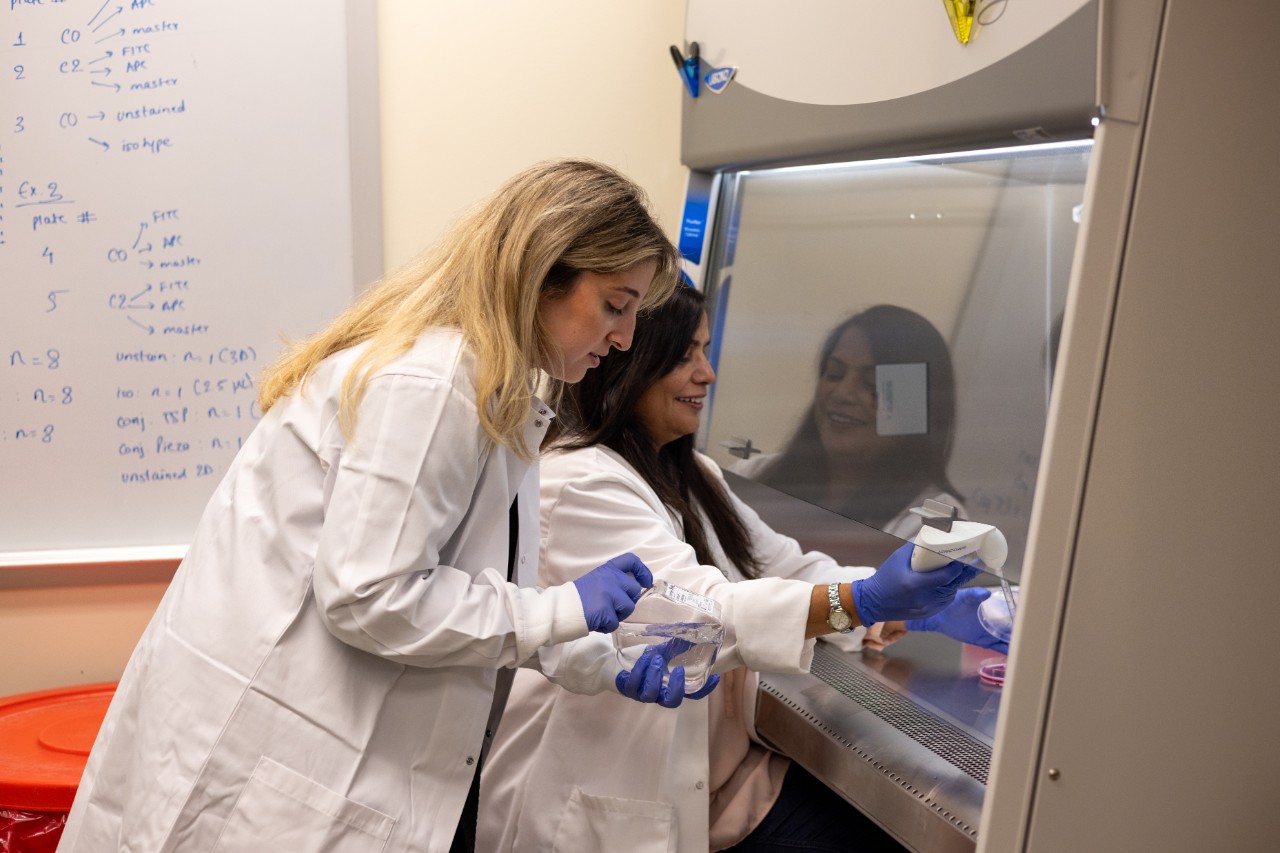 Yara Izhiman and Manju Sharma in the lab.