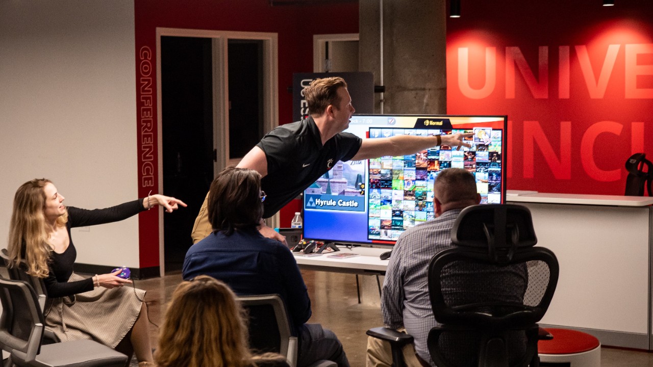 Workers perform strategic planning in UC's Esports Innovation Lab