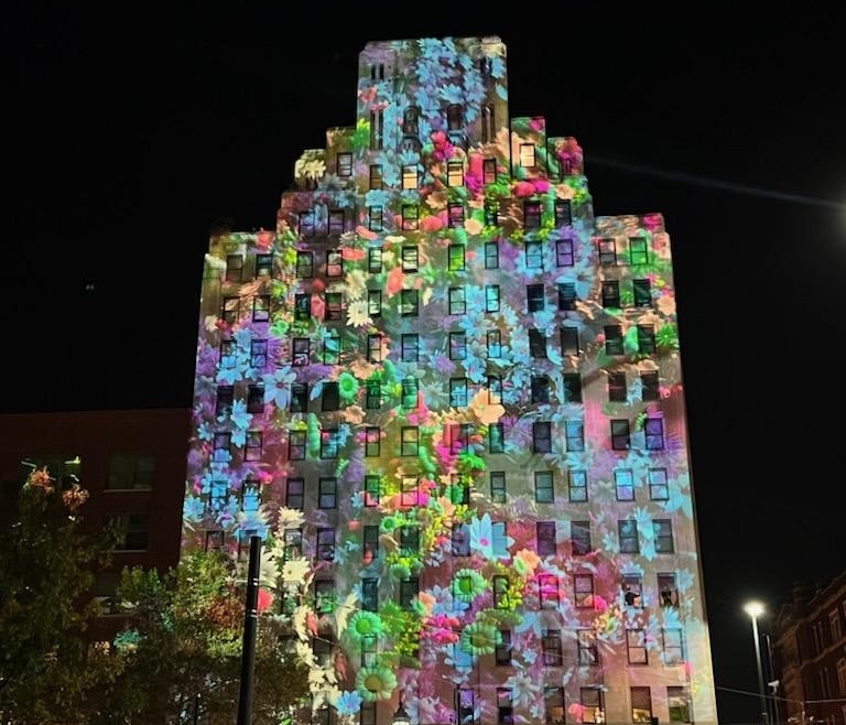 downtown Cincinnati building lit up with designs for BLINK