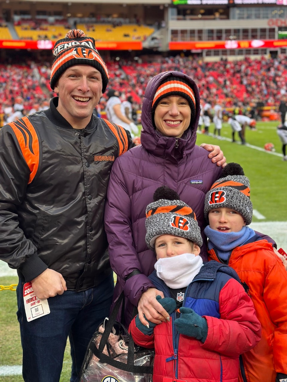Geoff Baldwin stands with his wife and two children.