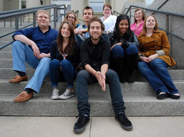 Jac Kern and her 2010 journalism class pose for a photo on steps