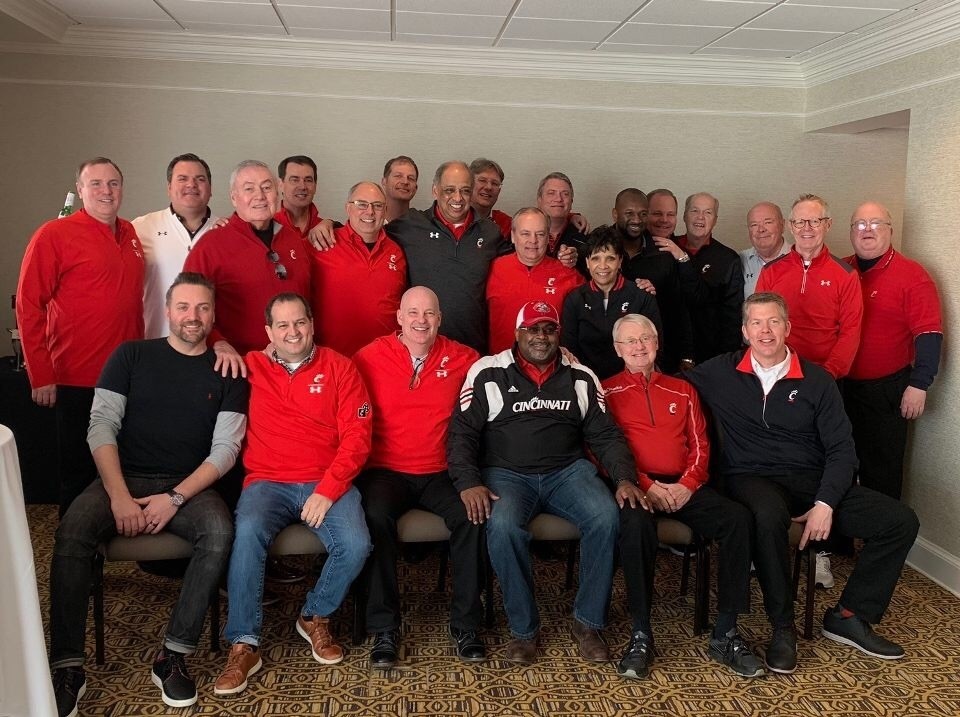 Greg Wolf, seated to the far right, with the Amgis and Red, Black and Hard Nines group.