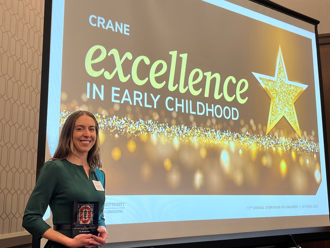 image of Dr. Randi Bates with an award