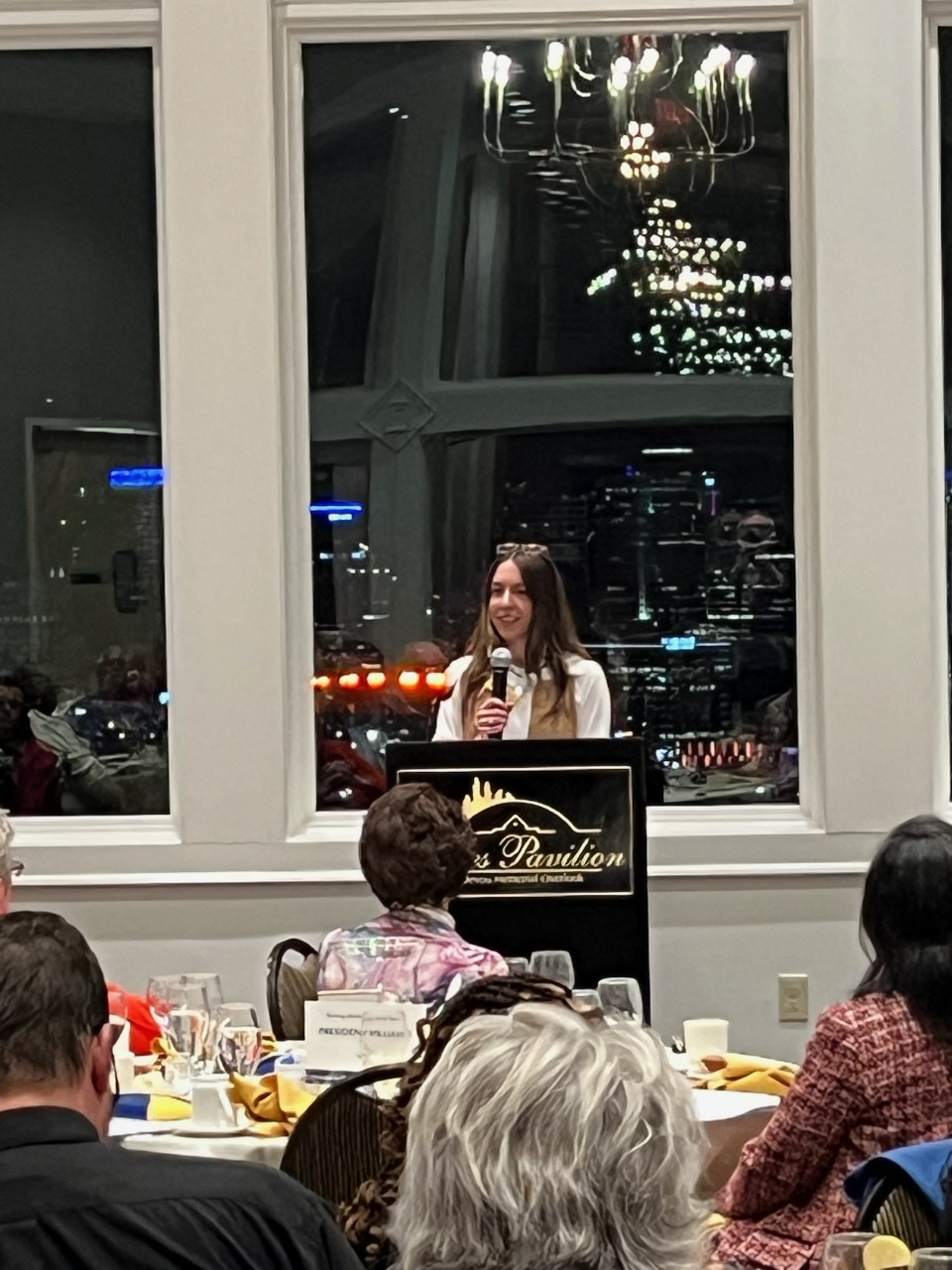 Dr. Randi Bates standing at a podium accepting an award